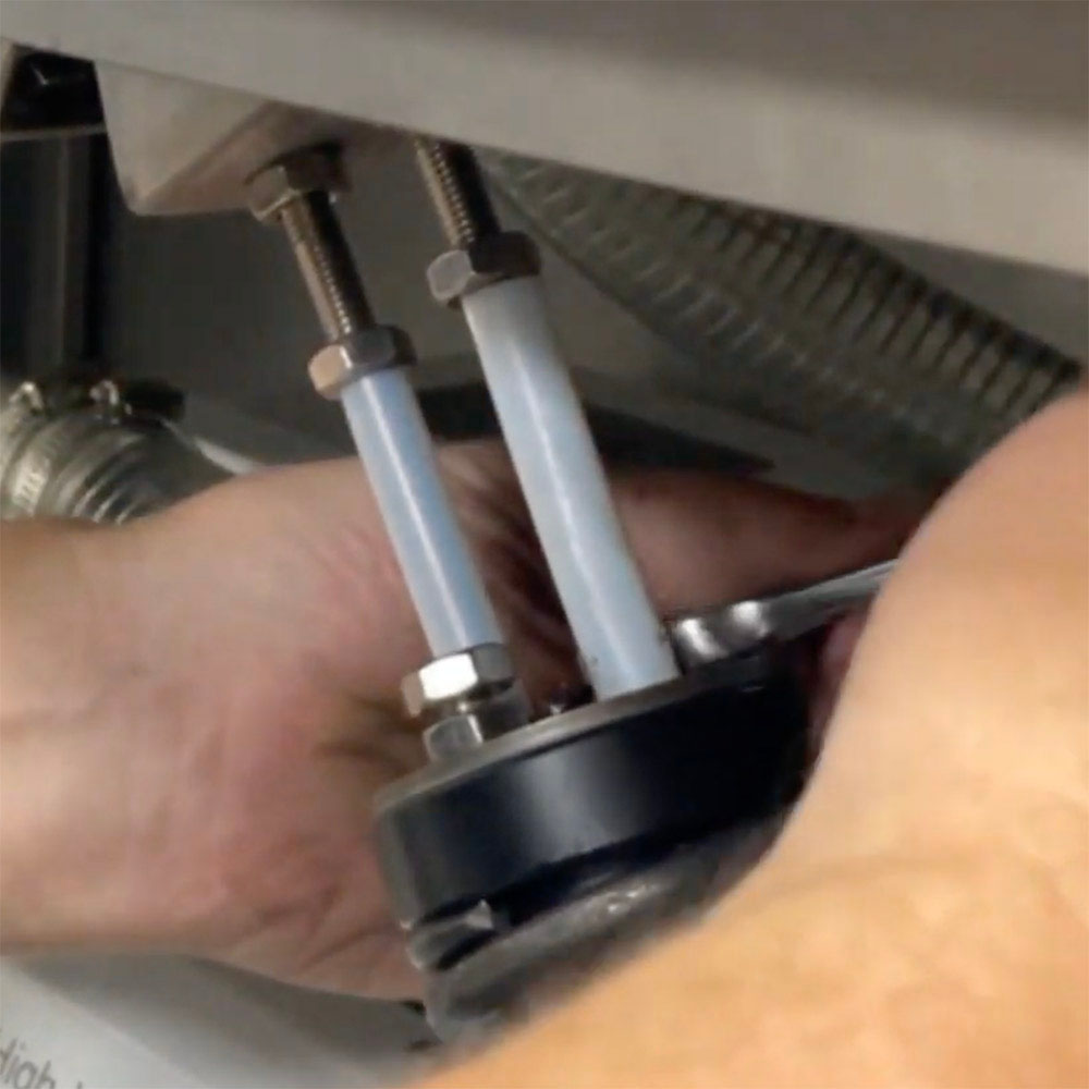 Repeating the procedure with the second set of nuts on the Vac610 lid spring.